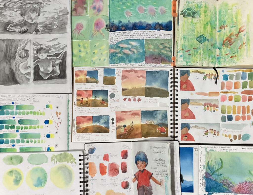 Several sketchbooks showing character and color palette studies for BETWEEN WORDS